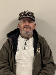 Ricky Poteete in a jacket and a hat.