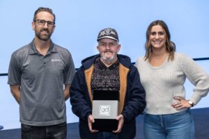 maxwell employees standing with Ricky Poteete