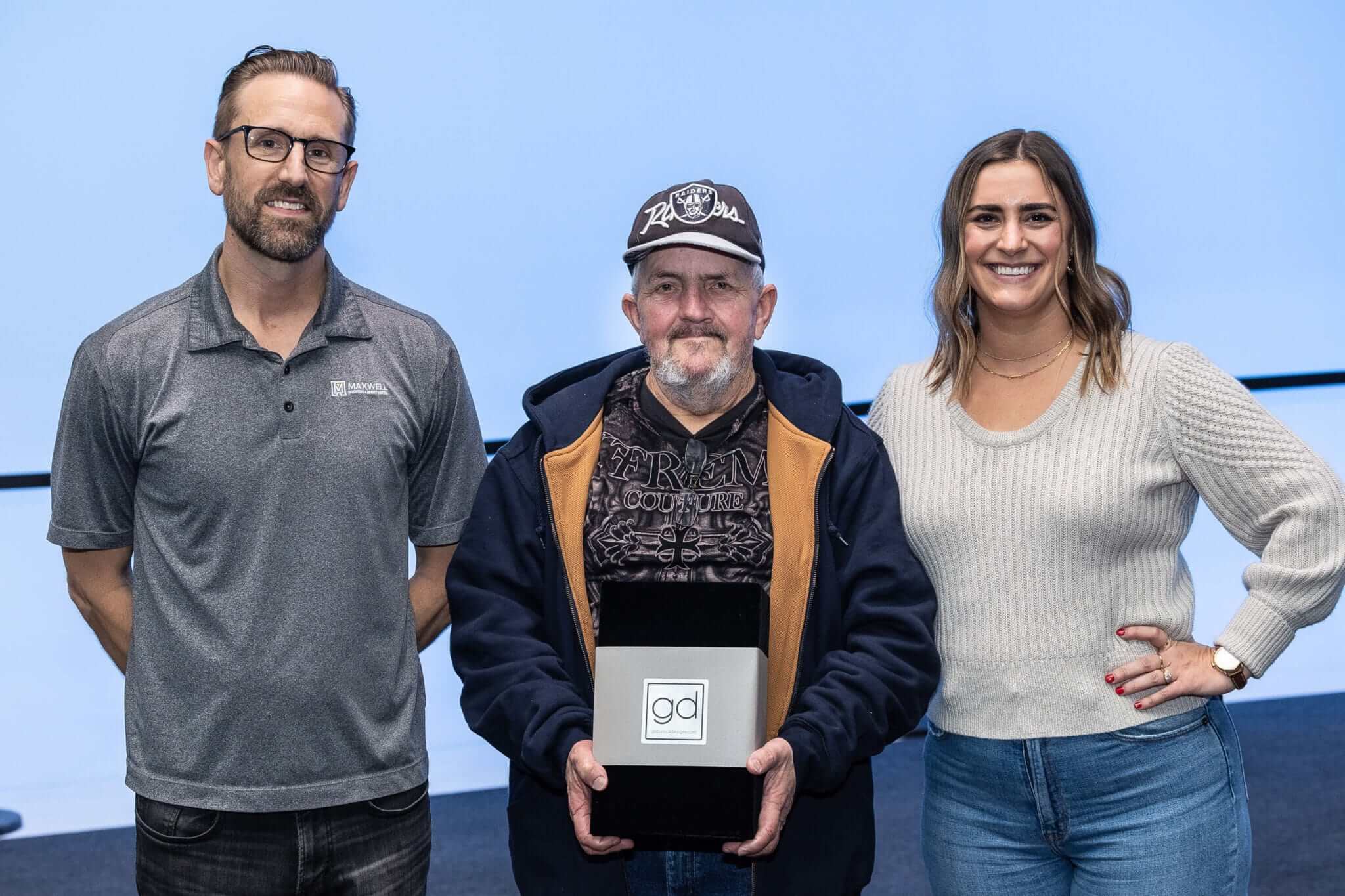 maxwell employees standing with Ricky Poteete