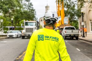 maxwell roofing employee walking down street