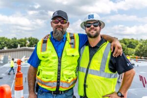maxwell roofing employees posing on a job site