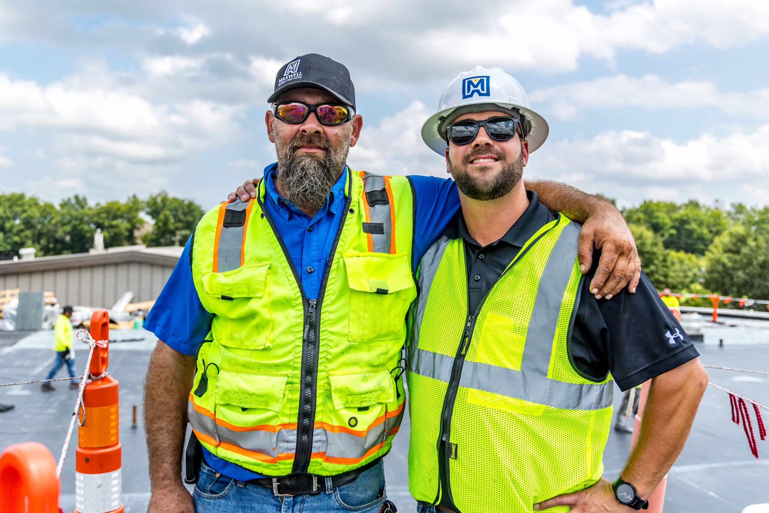 maxwell roofing employees posing on a job site